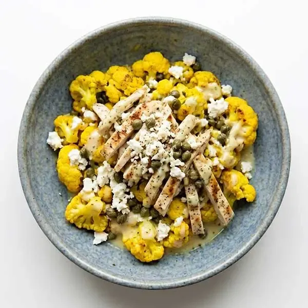 Baked Feta & Caper-stuffed Chicken with Turmeric Cauliflower & Lemon Sauce