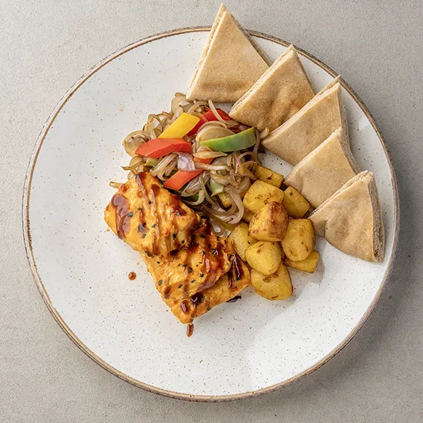 Roasted Fish With Pomegranate Molasses Braised Onion Peppers & Khubz